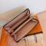 Image Portefeuille LOUIS VUITTON Zippy Toile enduite Marron